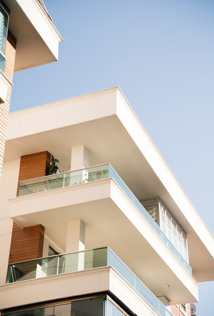 Elegant modern building exterior under a clear blue sky.